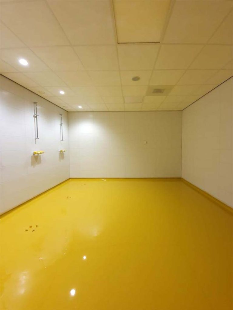 Yellow Commercial Use High Build Epoxy Flooring installed in a garage in Coventry by Elite Resin Scapes
