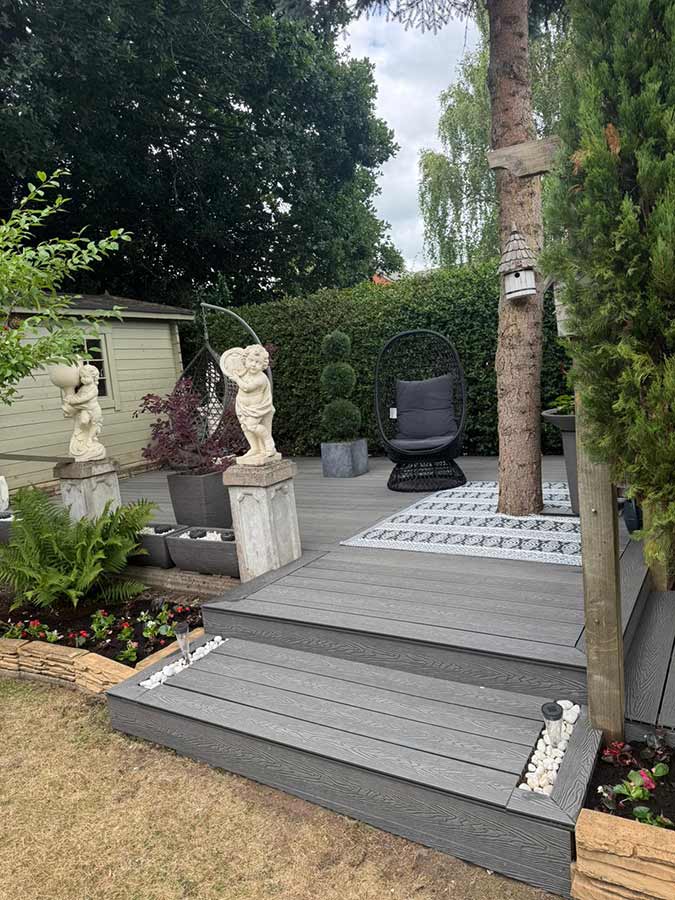 Composite decking including cut out for a tree trunk.